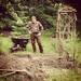"Farmer Bill" takes a break from fighting the hard clay while preparing a garden bed. (kayakwoman)